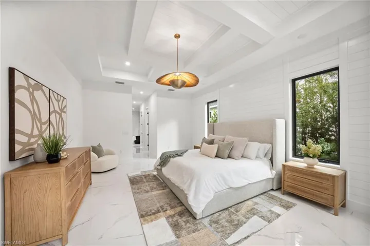 Featuring 4 bedrooms, 2 dens (one a loft/multi-purpose “family room”), 5 bathrooms, dual dining areas, dual laundry rooms, a 3-car garage, hurricane impact windows throughout, and a metal roof.