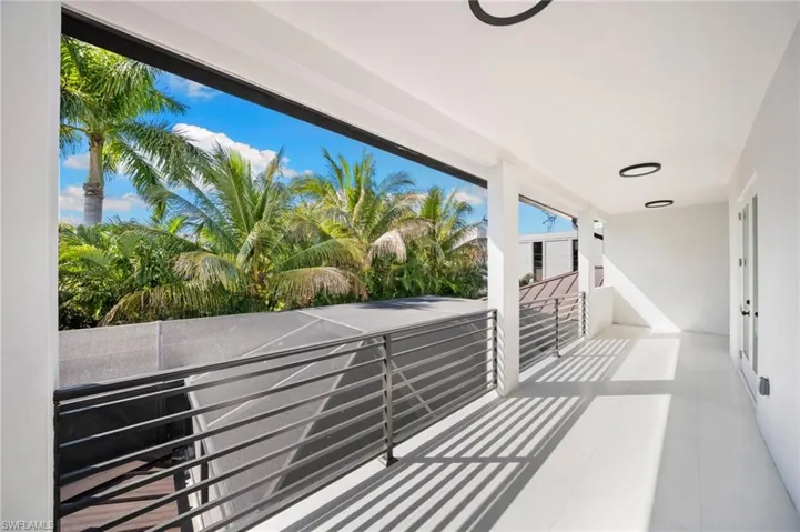 Upstairs, a loft-style cloud room with wet bar opens to a massive second-floor balcony, providing a private retreat ideal for entertaining or relaxation.