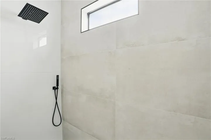 Full bathroom with a tile shower