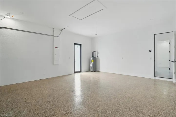 Garage with electric water heater and electric panel