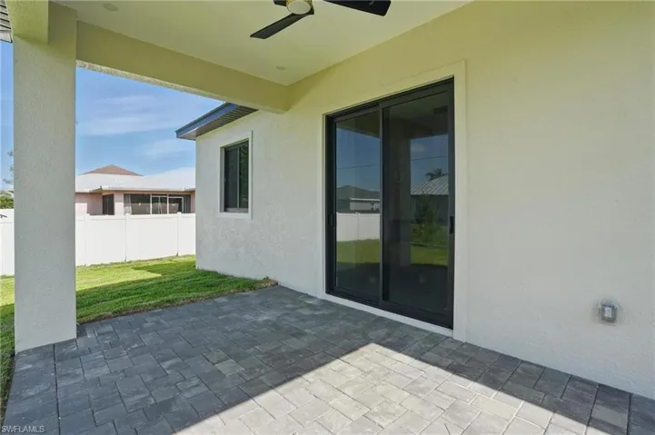View of patio with a ceiling fan
