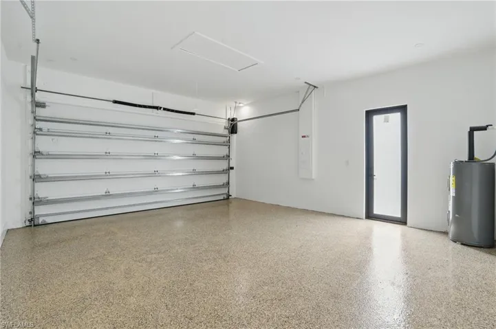 Garage featuring water heater