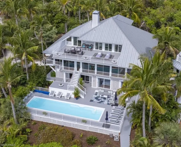 Back of property with an outdoor pool