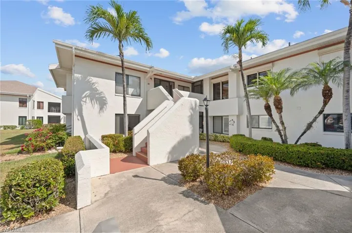 White stucco exterior with a multi-level design