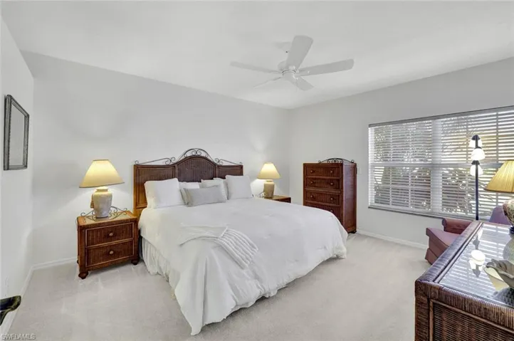 Bedroom with carpet floors and a ceiling fan