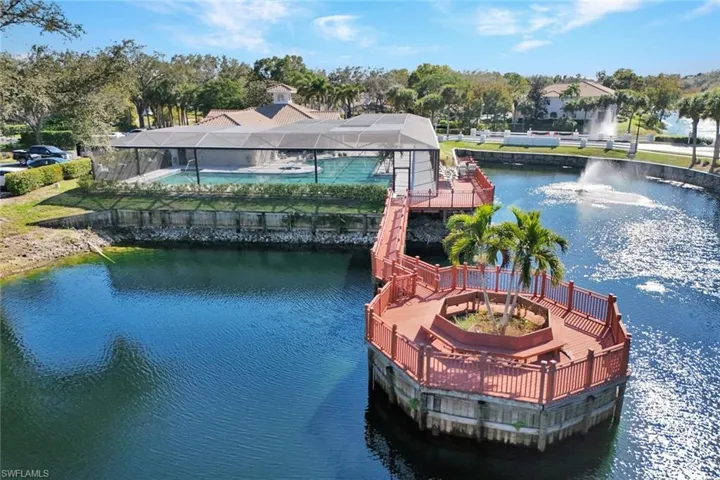 Dock featuring a water view and view of wooded area