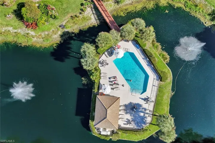 Aerial view of a nearby body of water and a pool