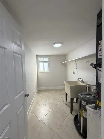 Laundry area with washer hookup and water heater