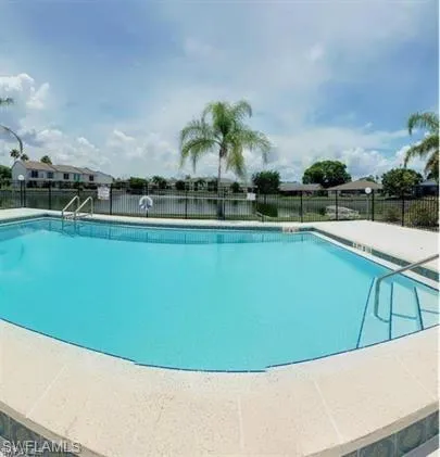 Community pool featuring a patio area
