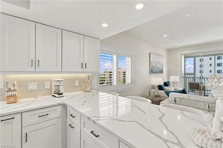 Quartz countertops, Shaker cabinets and Plantation Shutters on the extra side windows you get with the corner units.     (Photo may be digitally enhanced)