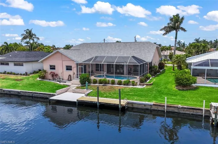 Aerial view of residential area featuring a large body of water