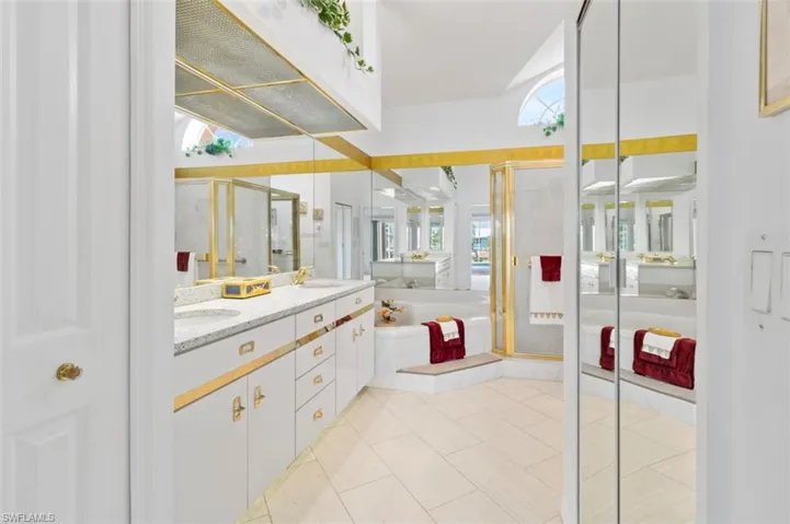 Swimming pool featuring a patio, ceiling fan, and glass enclosure