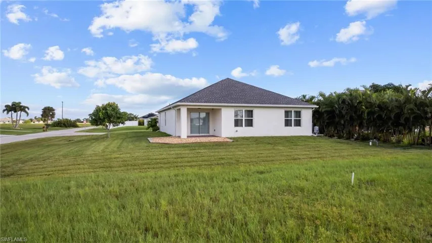 Single story home featuring a front yard