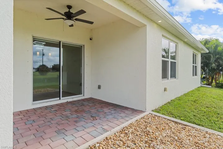 View of patio featuring ceiling fan