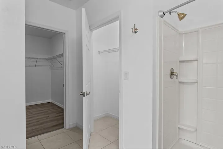Bathroom featuring a shower and wood-type flooring
