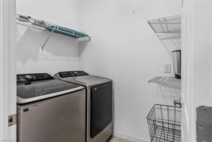Clothes washing area with washing machine and clothes dryer
