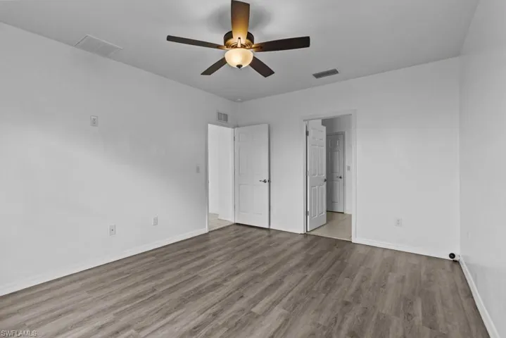 Unfurnished bedroom with light hardwood / wood-style flooring and ceiling fan