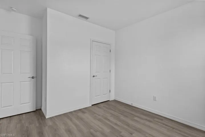 Unfurnished bedroom featuring light hardwood / wood-style flooring