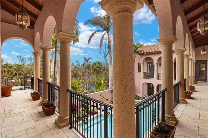 Balcony featuring view of pool