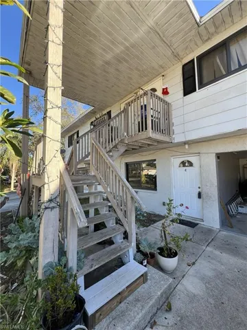 Property entrance featuring stucco siding