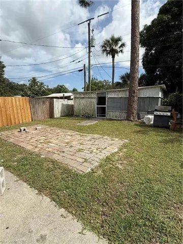 Fenced backyard featuring a patio