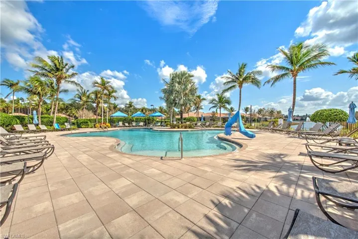 Community pool with a patio area