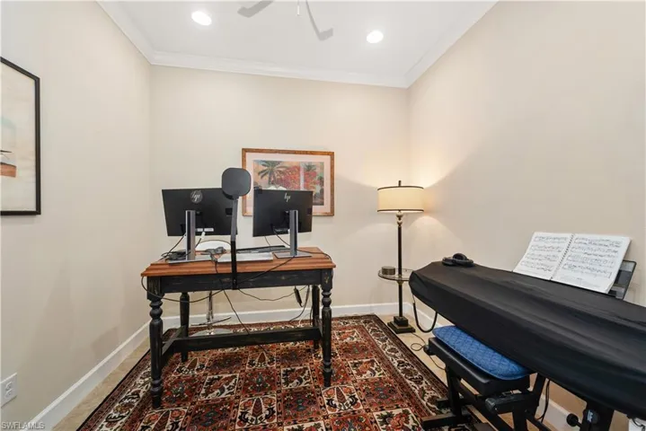 Office space featuring crown molding, recessed lighting, a ceiling fan, and tile flooring