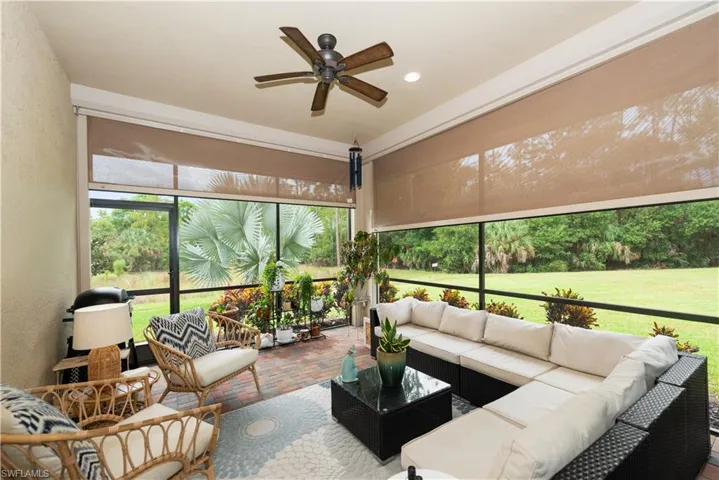 Lanai with brick floors, ceiling fan and recessed lighting