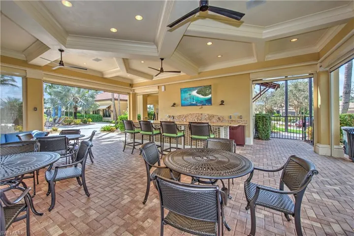 View of patio featuring a ceiling fan and outdoor dining area