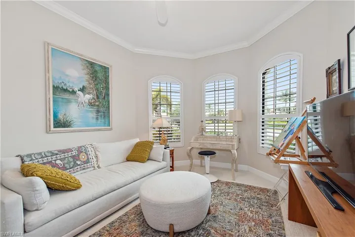 Carpeted 3rd Bedroom used as a sitting room/art studio with lots of light!