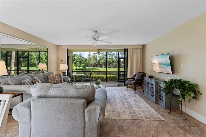 Living room featuring ceiling fan