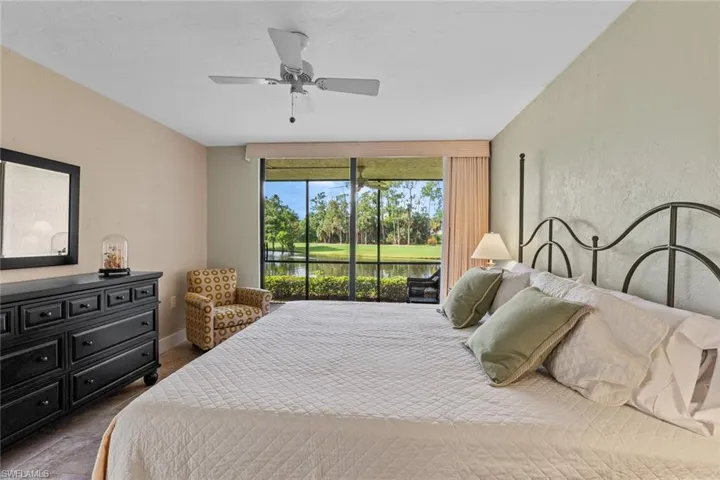 Bedroom featuring access to exterior and ceiling fan