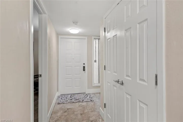 Hall with light tile floors
