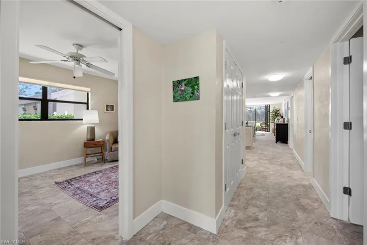 Hall featuring light tile floors