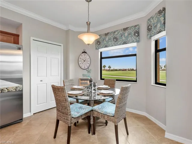 Eat In Kitchen with Crown Molding, Pantry, Bay Windows with Window Treatments, & Golf Course View
