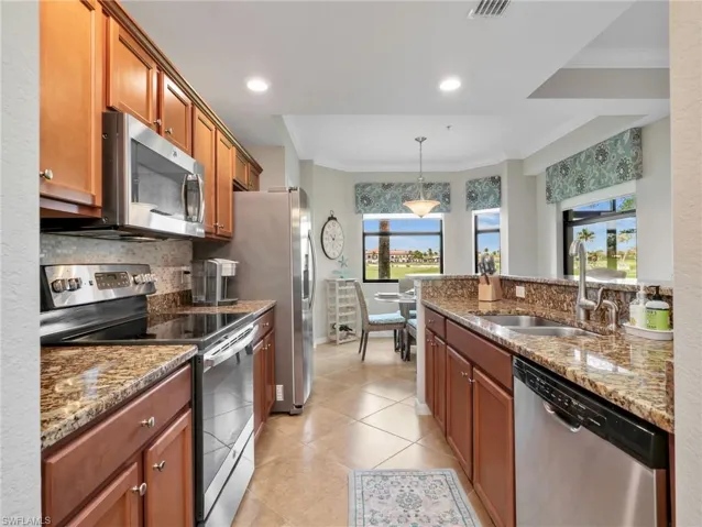 Kitchen with Stainless Steel Appliances, Stainless Steel Sink, Granite Counters, Tile Backsplash, & Eat In Kitchen with Bay Window & Window Treatments