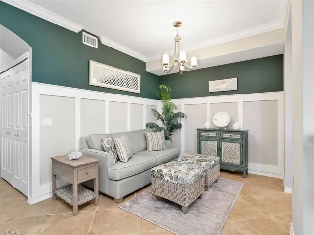 Nook/Dining Area with Board & Batten Wall Treatment, Crown Molding, & Chandelier