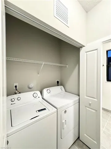 Clothes washing area with washing machine and dryer