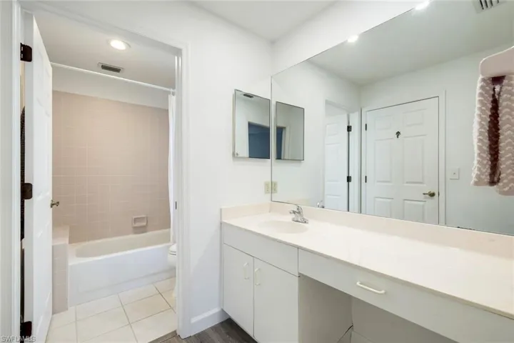 Primary bathroom features a shower/tub combo.