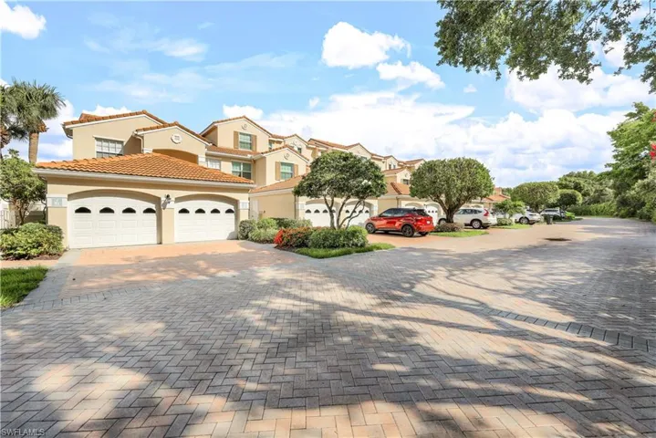 View of front of home with a 1 car garage