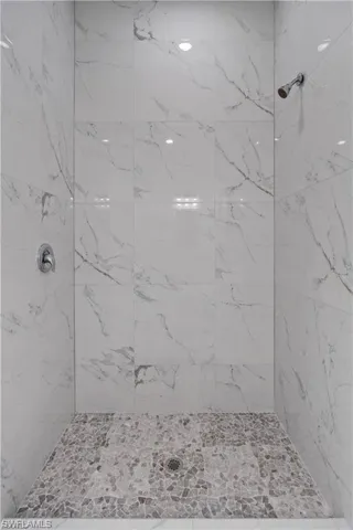 Full bath with a tile shower