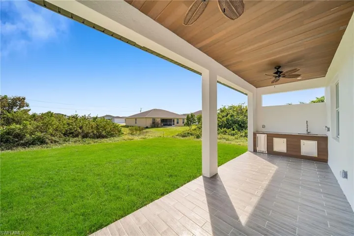View of patio featuring ceiling fan