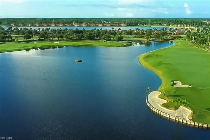 Drone / aerial view featuring a water view and golf course view