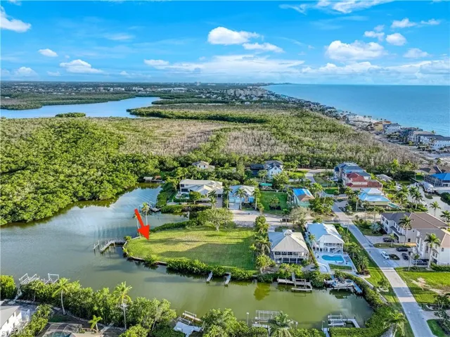 Aerial perspective of suburban area with a nearby body of water