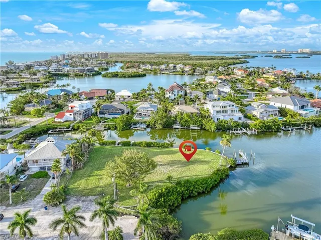 Aerial perspective of suburban area with a nearby body of water