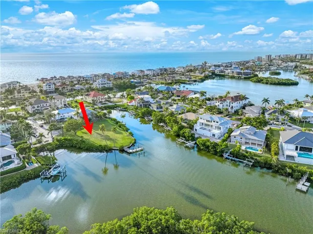 Aerial view of residential area with a nearby body of water