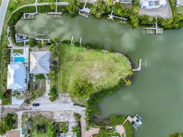 Aerial overview of property's location with a nearby body of water