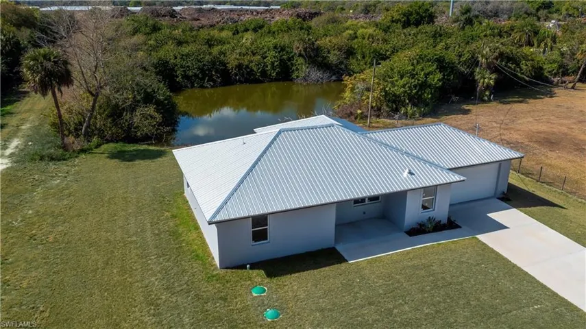 View of subject property featuring a nearby body of water