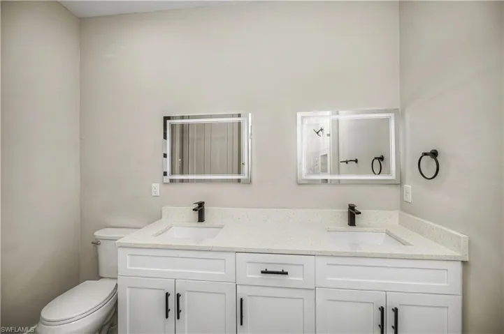 Bathroom with double vanity and a shower