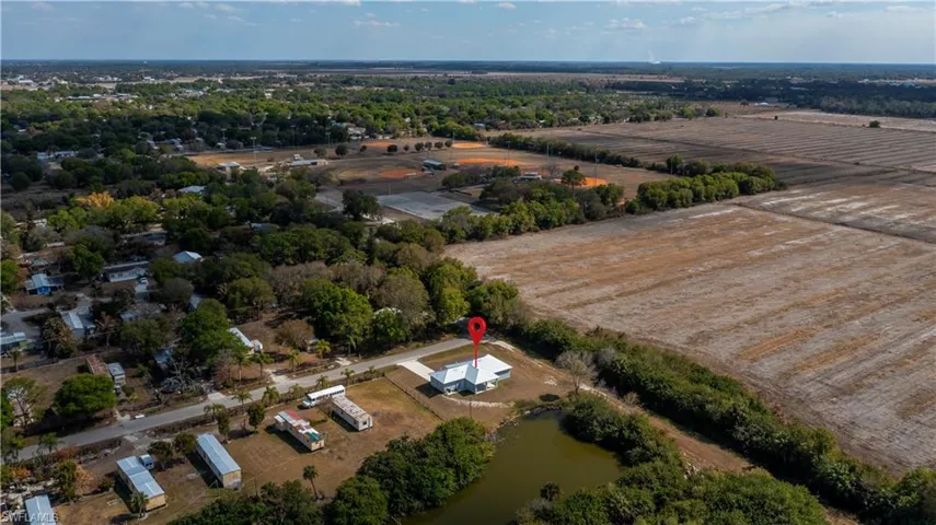 View of property location featuring rural landscape, a large body of water, and abundant farmland